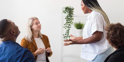 Group discussion with diverse participants in a bright room