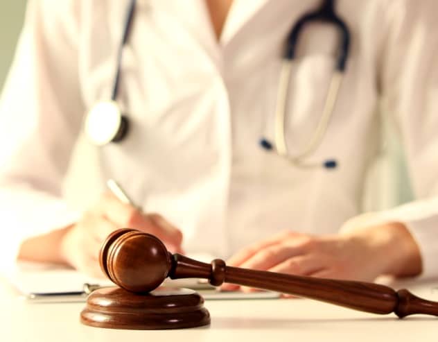 Medical Professional With Gavel & Notepad