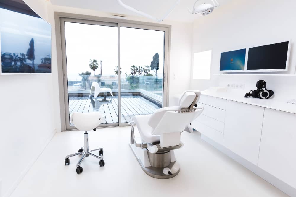 Modern dental office with treatment chair and digital equipment